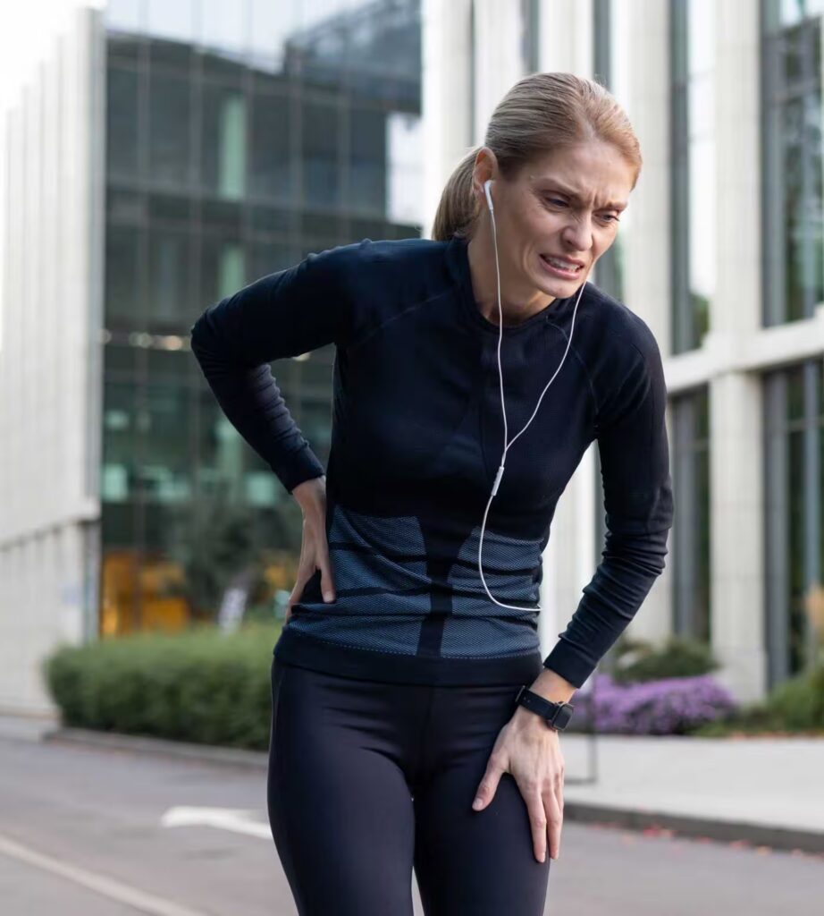 female runner experiencing side stitch pain during 2026 01 09 07 34 19 utc converted