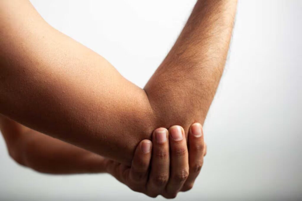 man holding elbow joint due to pain bone pain 2026 01 07 23 46 40 utc converted