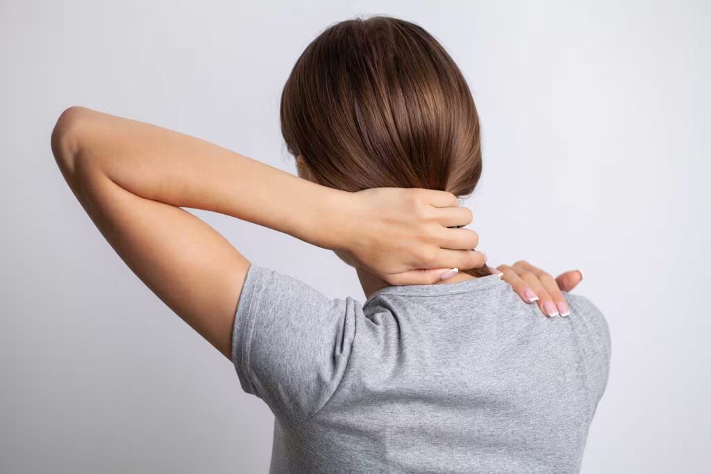 sick woman suffering from sore neck on gray backgr 2026 01 08 05 37 41 utc converted